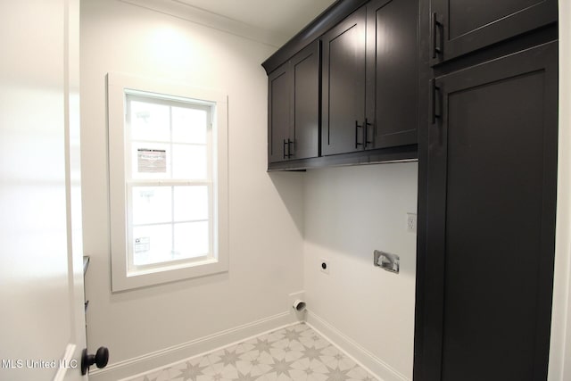 laundry area featuring light floors, cabinet space, ornamental molding, hookup for an electric dryer, and baseboards