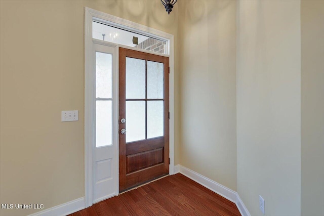 foyer entrance with dark hardwood / wood-style floors