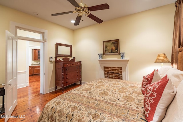 bedroom with recessed lighting, a ceiling fan, baseboards, and hardwood / wood-style flooring