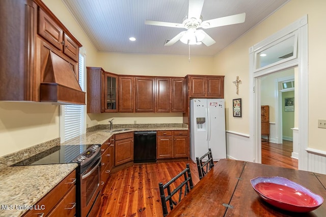 kitchen with dark wood-style flooring, white refrigerator with ice dispenser, stainless steel range with electric stovetop, premium range hood, and black dishwasher