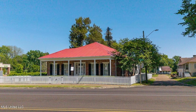 view of building exterior featuring fence private yard