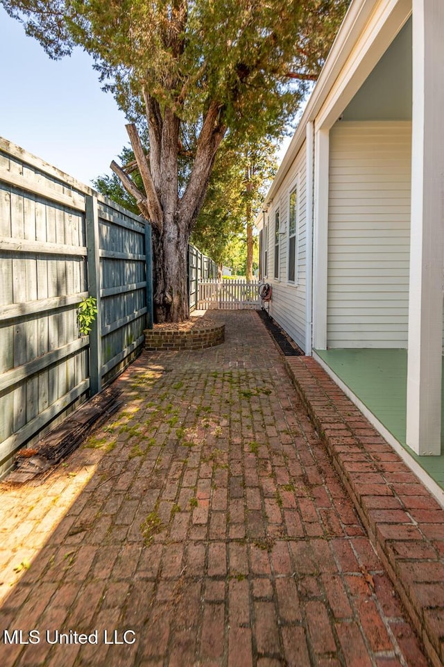 view of patio / terrace featuring fence