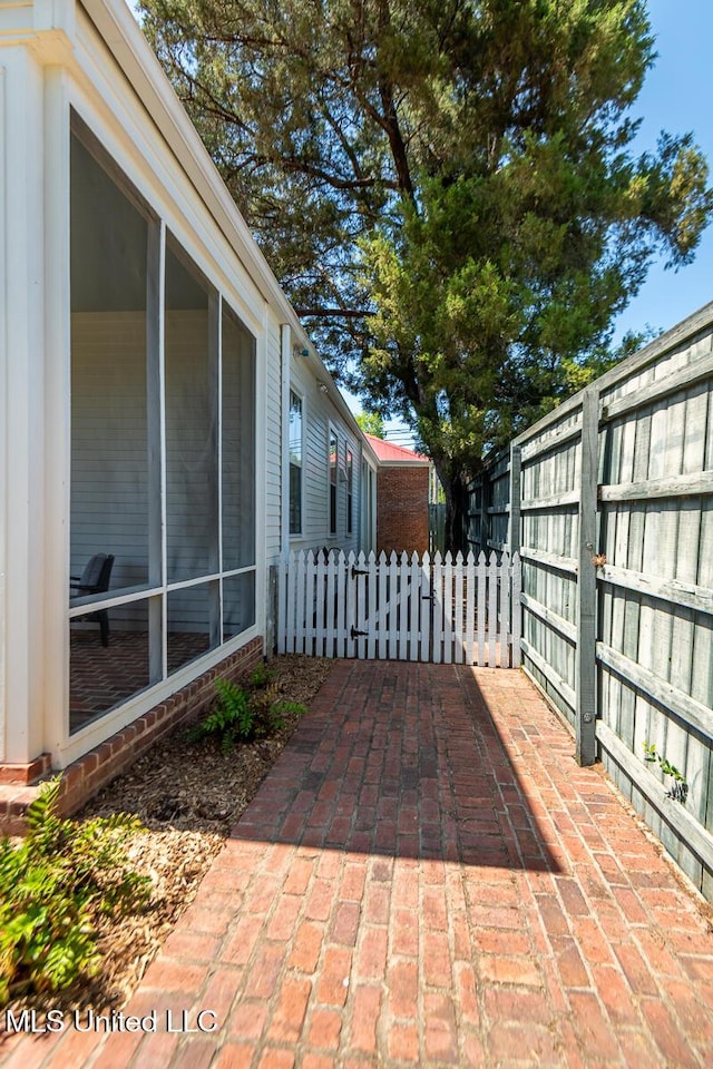 view of patio featuring fence