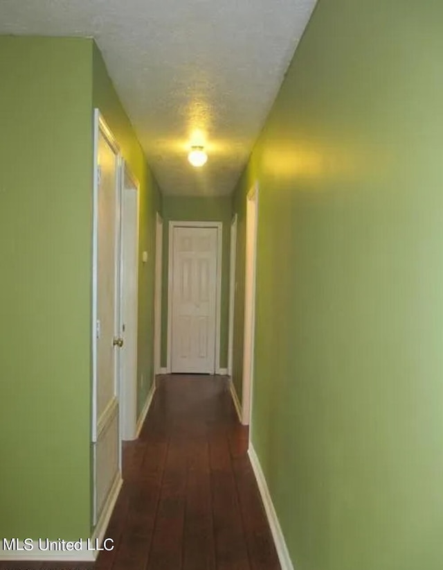 hall with dark hardwood / wood-style flooring