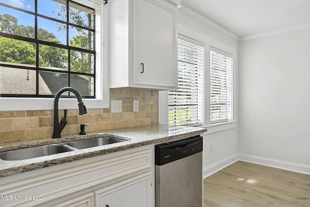 132 Bent Creek Dr, Brandon, MS 39047 - kitchen featuring stainless steel dishwasher, backsplash, light wood-style flooring, white cabinetry, and light stone countertops