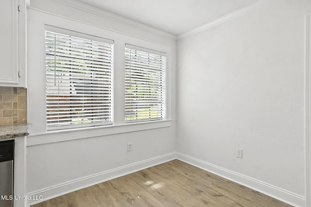 132 Bent Creek Dr, Brandon, MS 39047 - unfurnished dining area with ornamental molding and light wood-style flooring