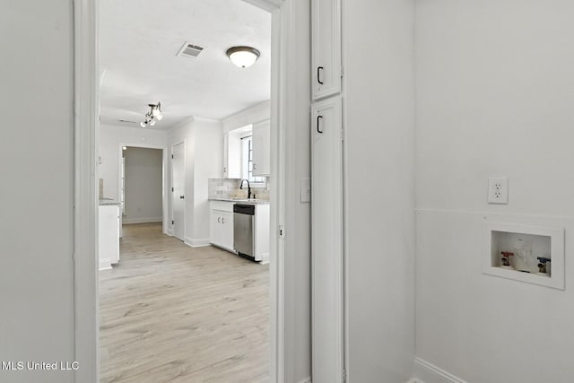 132 Bent Creek Dr, Brandon, MS 39047 - laundry room with washer hookup and light wood finished floors