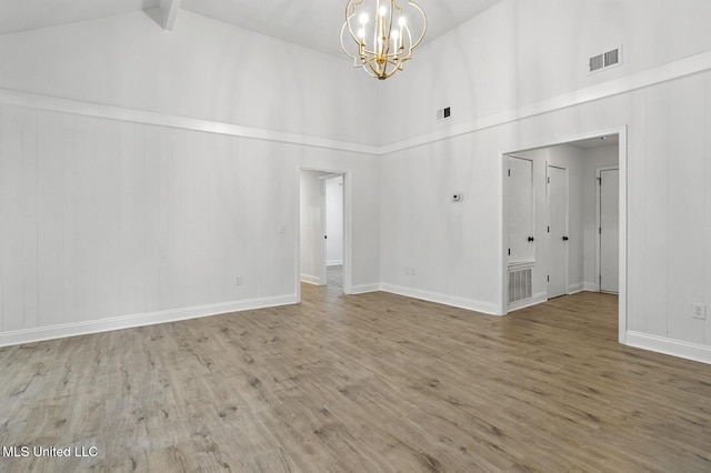 132 Bent Creek Dr, Brandon, MS 39047 - unfurnished room featuring a chandelier, high vaulted ceiling, wood finished floors, and beam ceiling