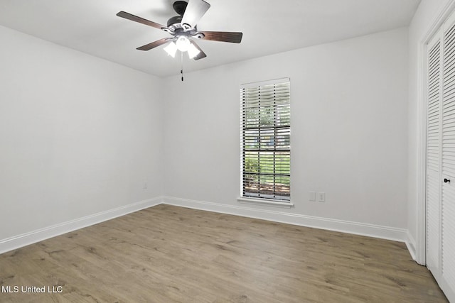 132 Bent Creek Dr, Brandon, MS 39047 - unfurnished bedroom with a closet, wood finished floors, and a ceiling fan