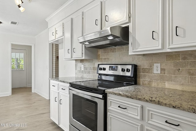 132 Bent Creek Dr, Brandon, MS 39047 - kitchen featuring stainless steel electric range oven, under cabinet range hood, ornamental molding, white cabinetry, and light stone counters