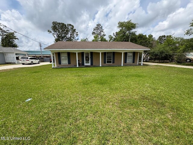 710 Beyer Dr, Bay Saint Louis, MS 39520 - view of front of house featuring a porch, a front yard, and concrete driveway