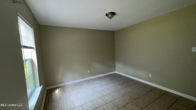 empty room featuring tile patterned flooring