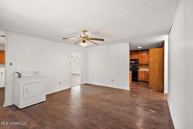 unfurnished living room featuring dark hardwood / wood-style floors, ceiling fan, washer / dryer, and a textured ceiling