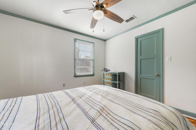 unfurnished bedroom with ceiling fan and crown molding