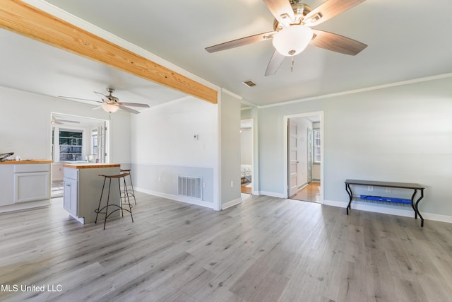 living room with light hardwood / wood-style flooring and ceiling fan