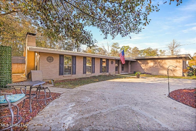 view of front of house with a patio area