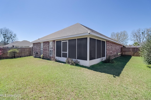 13056 Jordan Pl, Gulfport, MS 39503 - rear view of property with a sunroom and brick siding