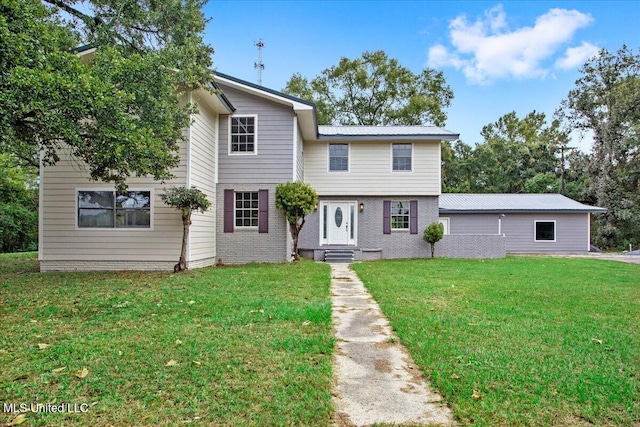 view of front facade with a front lawn