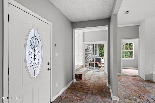 foyer featuring a textured ceiling