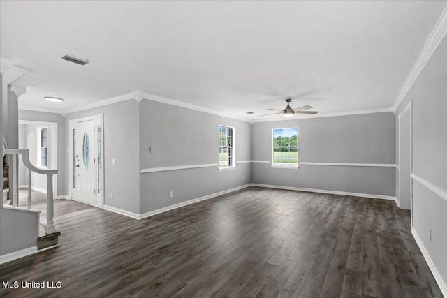 spare room with crown molding, dark hardwood / wood-style flooring, ceiling fan, and a textured ceiling