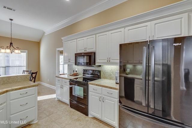 kitchen with visible vents, white cabinets, light countertops, black appliances, and tasteful backsplash