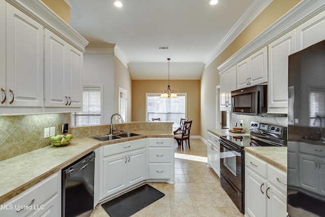 kitchen featuring black appliances, a sink, light countertops, and white cabinets