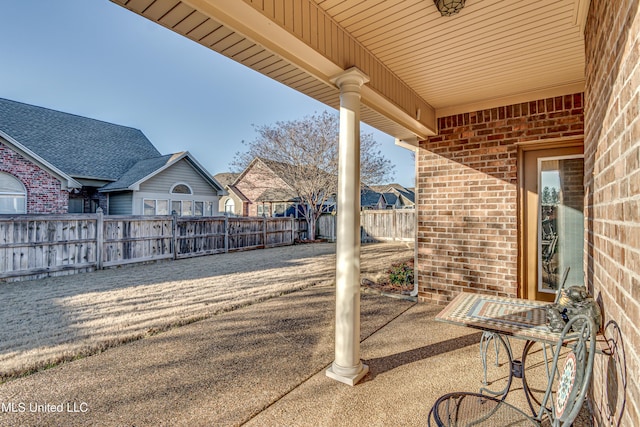 view of patio / terrace featuring fence