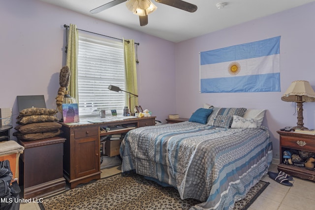 bedroom featuring ceiling fan, multiple windows, and light tile patterned floors