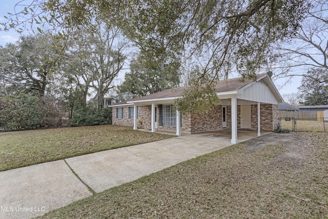 single story home featuring a carport and a front yard