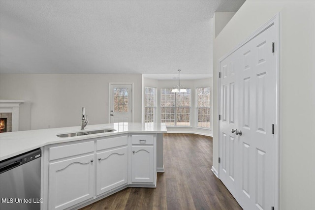 kitchen featuring a sink, white cabinets, dishwasher, a chandelier, and dark wood-style flooring