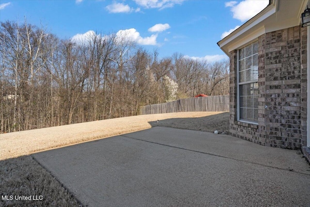 view of yard with a patio area and fence