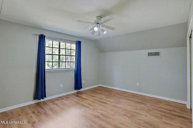 bonus room with light hardwood / wood-style floors, ceiling fan, and vaulted ceiling