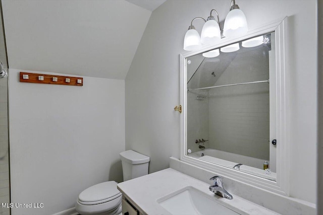 full bathroom with vanity, tiled shower / bath, toilet, and vaulted ceiling