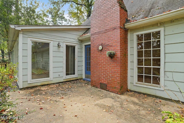 doorway to property with a patio