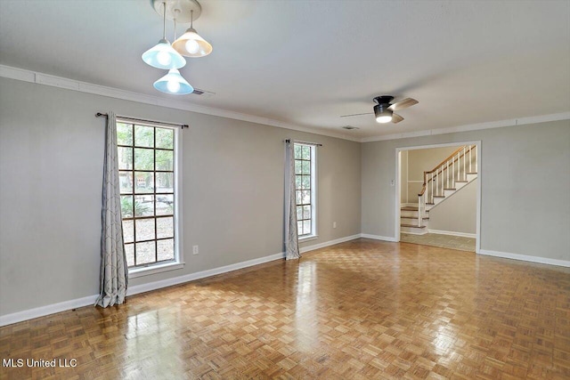 empty room featuring parquet flooring and a wealth of natural light