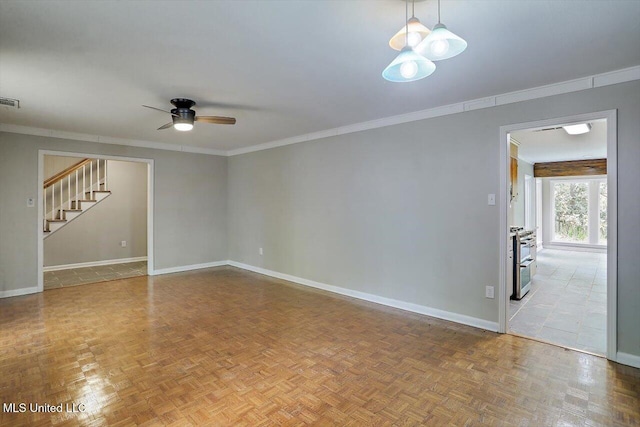 spare room with parquet flooring, ornamental molding, and ceiling fan