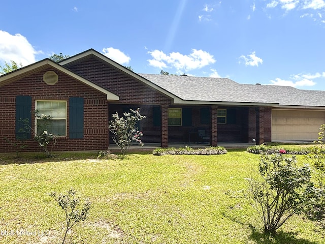 ranch-style house with an attached garage, a porch, a front yard, brick siding, and roof with shingles