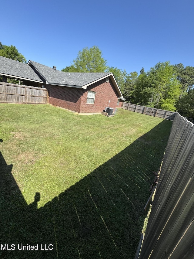 view of yard with a fenced backyard