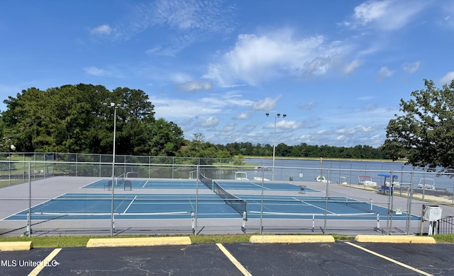 106 Donnybrook Dr, Carriere, MS 39426 - view of tennis court with fence and view of scattered trees