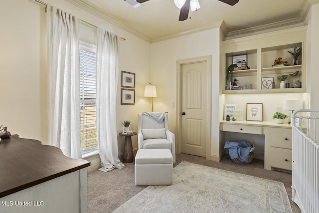 sitting room featuring a wealth of natural light, carpet flooring, ornamental molding, and built in desk