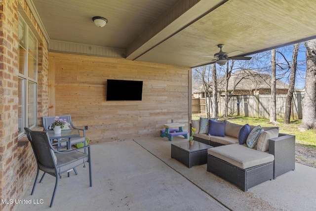 view of patio / terrace with an outdoor hangout area, ceiling fan, and fence