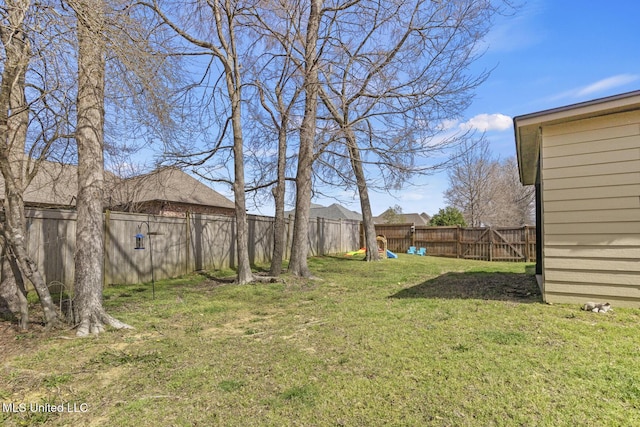 view of yard with a fenced backyard