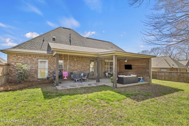 rear view of house with a patio area, outdoor lounge area, ceiling fan, and fence