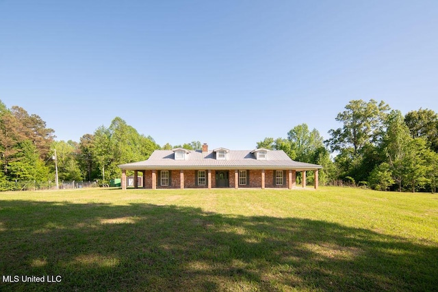 290 Abigail Ln, Bentonia, MS 39040 - rear view of house featuring a yard and metal roof