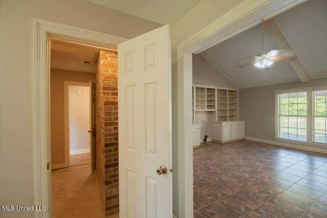 290 Abigail Ln, Bentonia, MS 39040 - unfurnished room featuring ceiling fan, baseboards, built in features, and lofted ceiling with beams