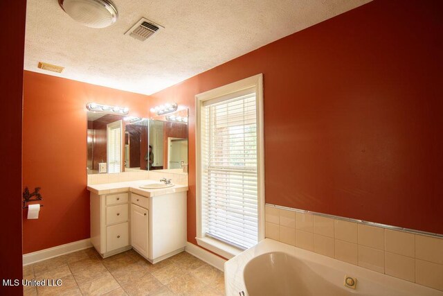 290 Abigail Ln, Bentonia, MS 39040 - bathroom with a textured ceiling, baseboards, visible vents, and vanity