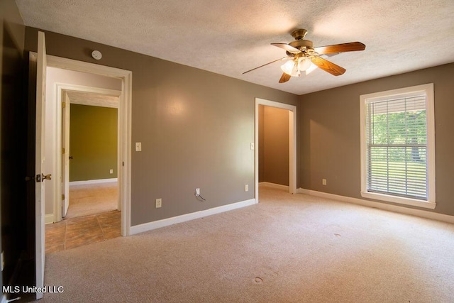 290 Abigail Ln, Bentonia, MS 39040 - unfurnished room with light colored carpet, ceiling fan, baseboards, and a textured ceiling