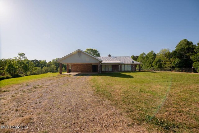 290 Abigail Ln, Bentonia, MS 39040 - single story home featuring brick siding, a front lawn, an attached carport, and dirt driveway
