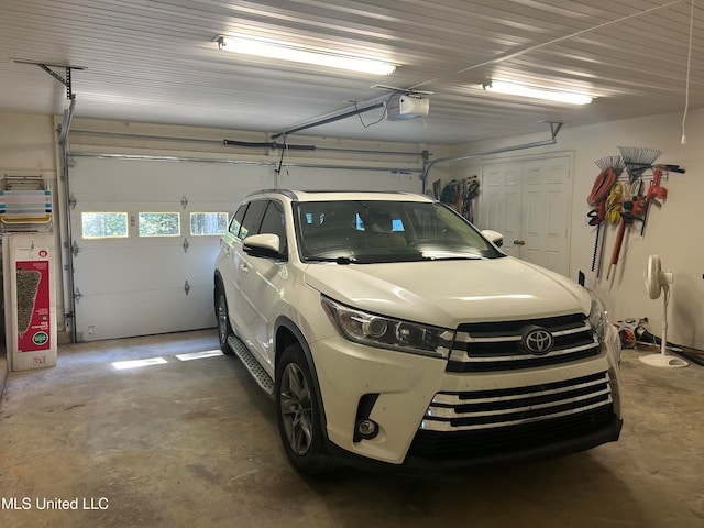 garage featuring a garage door opener