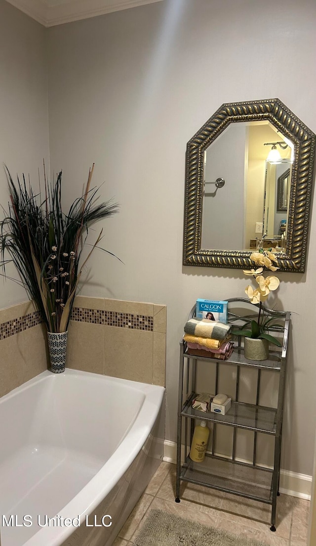 bathroom with crown molding, tile patterned floors, and tiled bath